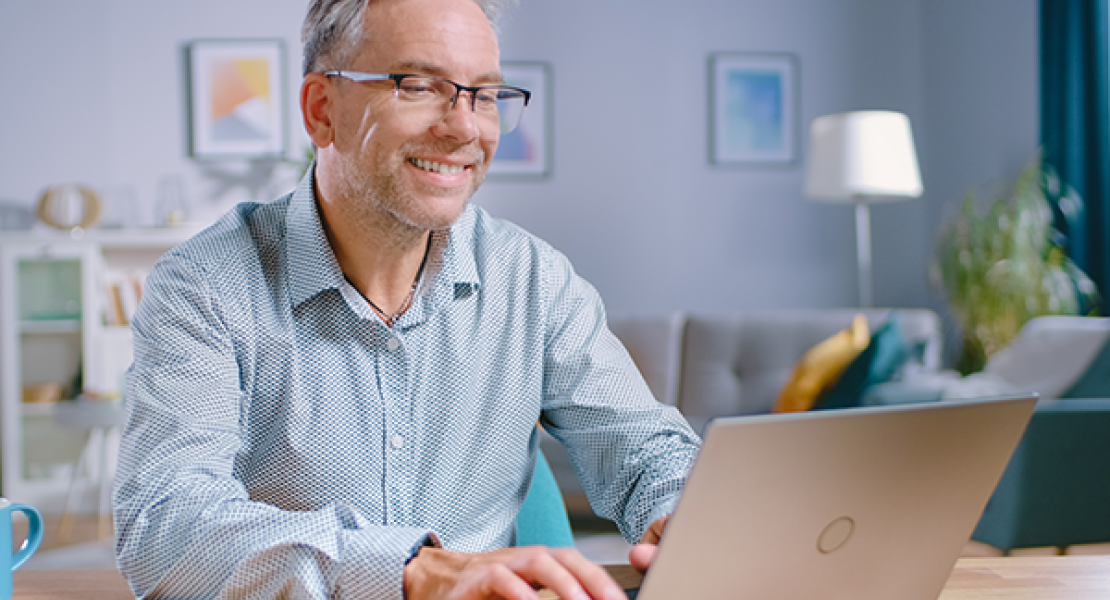 Male instructor using his laptop