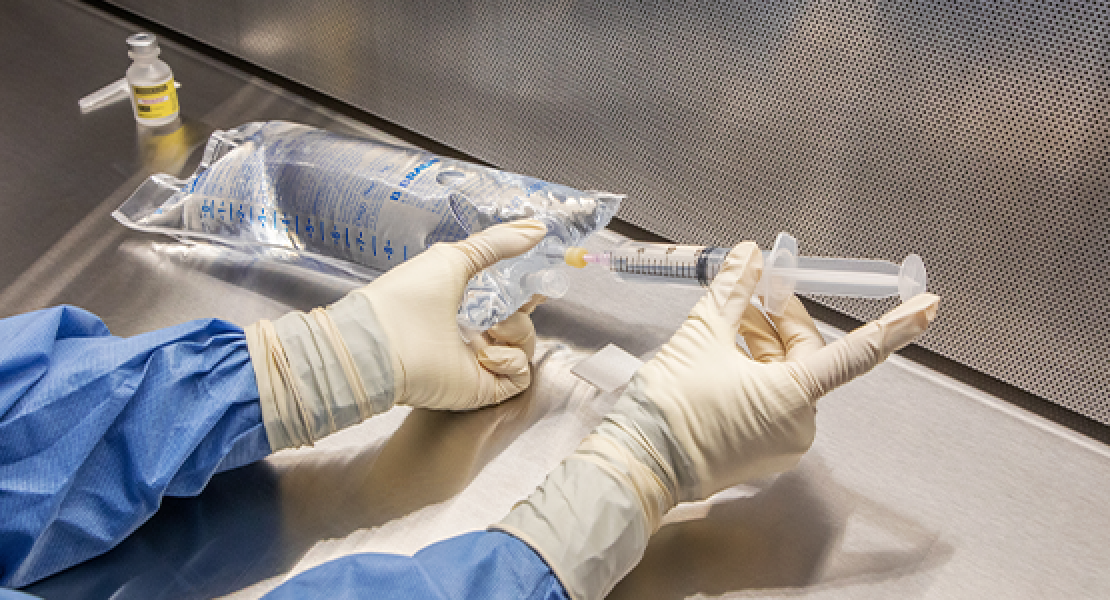 Sterile compounding happening under a hood
